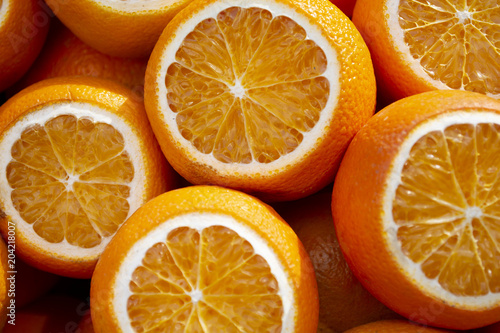 Colorful fruit pattern of fresh orange slices. From top view