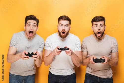 Three young shocked men photo