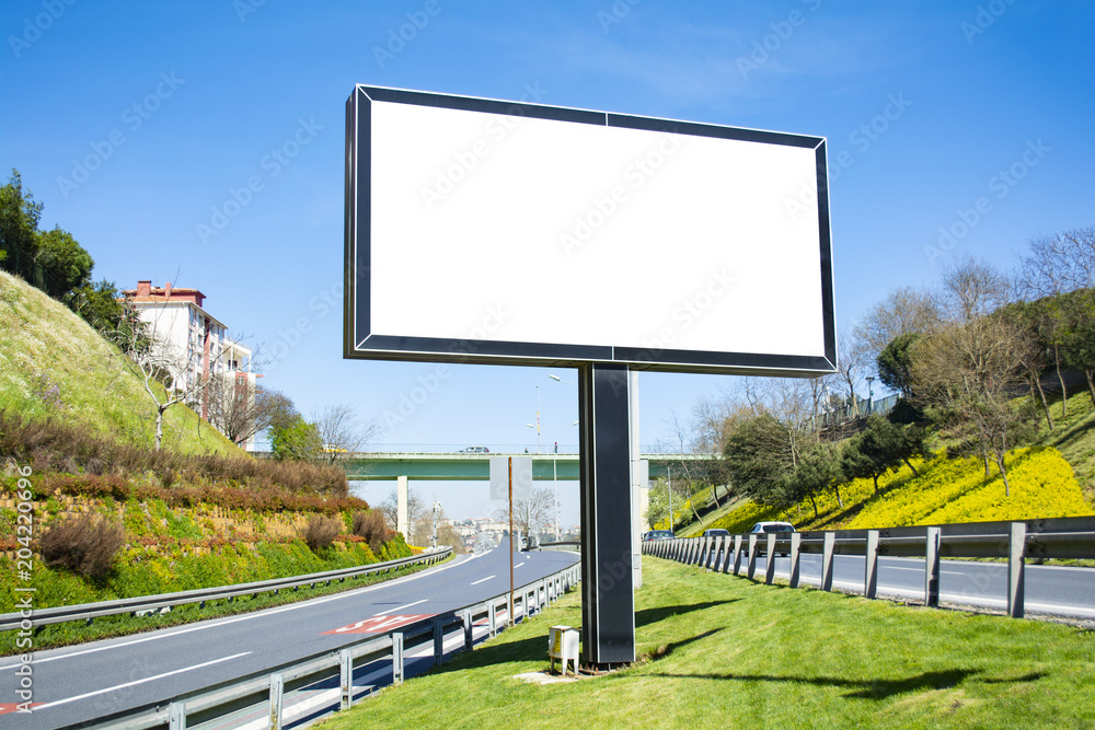 Obraz premium Large blank billboard located on the side of the road.
