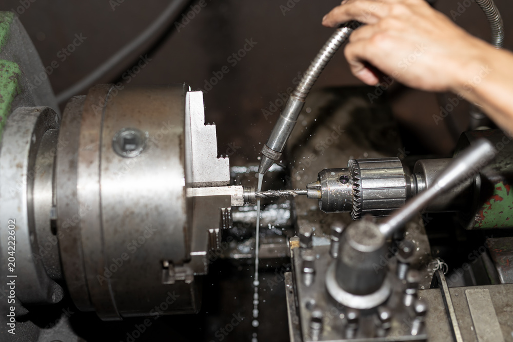.The cooled water to parts on a lathe. Metalworking industry .The cooled water to parts on a lathe. Metalworking industry