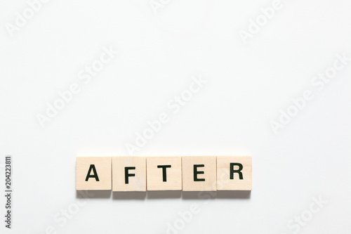 word after made of wooden block isolated on white background