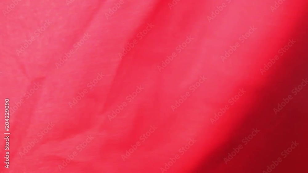 Red cloth or silk flag waving at wind. Holiday background. Red cloth or silk flag waving at wind. Holiday background.