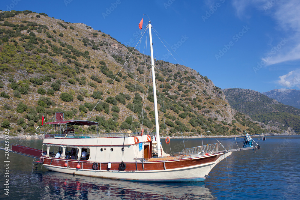 Turkish touristic boats over calm sea in Olu Deniz, Turkey