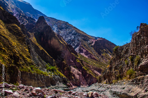 View of Iruya village and multicolored mountains in the surroundings at sunset, Salta province, Argentina, iruya - San Isidro - San Juan treeking photo