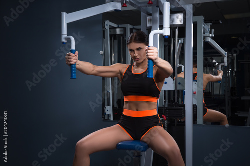 Sport. Beautiful woman in gym. Halthy concept