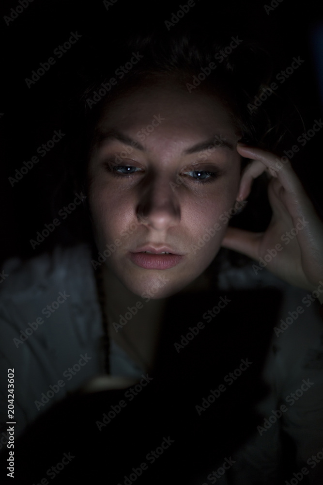 Young woman using mobile phone late at night Young woman using mobile phone late at night