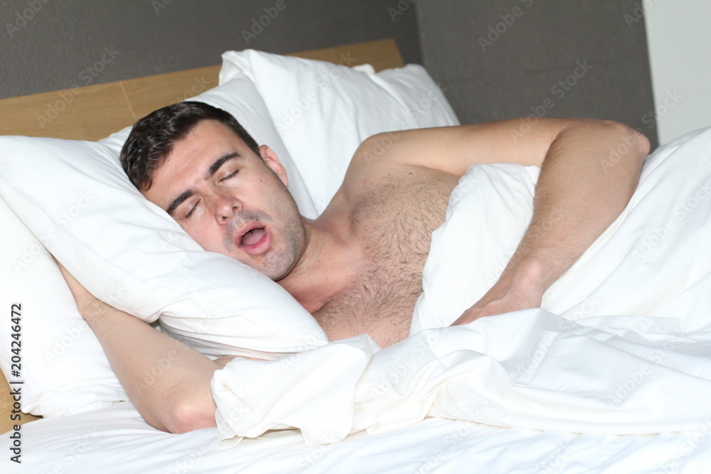 Funny man snoring in bed Stock Photo | Adobe Stock
