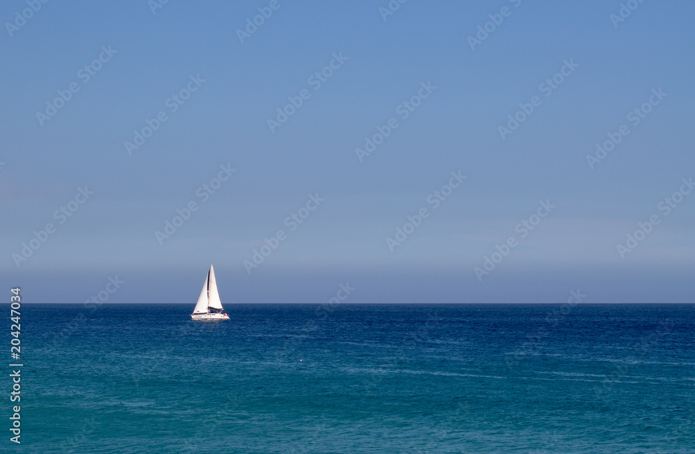 Sailing in the open blue ocean and sky in Mexico