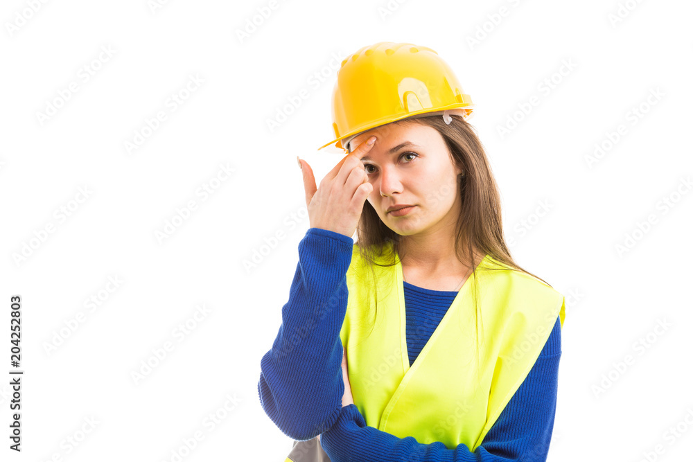 Young attractive female architect thinking. Young attractive female architect thinking.