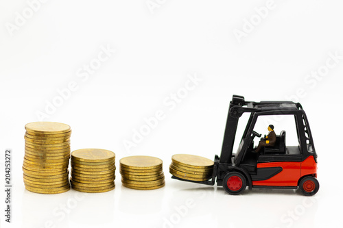 Stack of coins with truck. Image use for increase income, business concept.