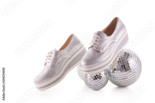 Silvery sneakers on white background.. photo