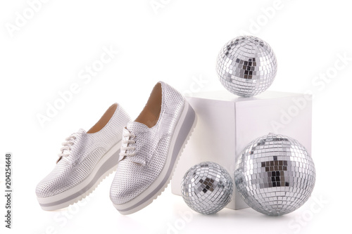 Silvery sneakers on white background..