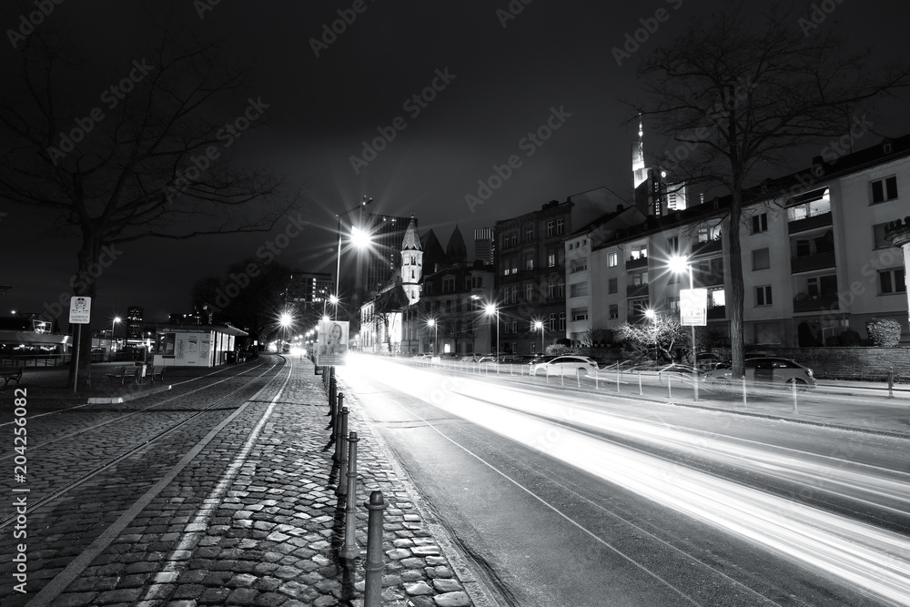Street in the night time monochrome photo