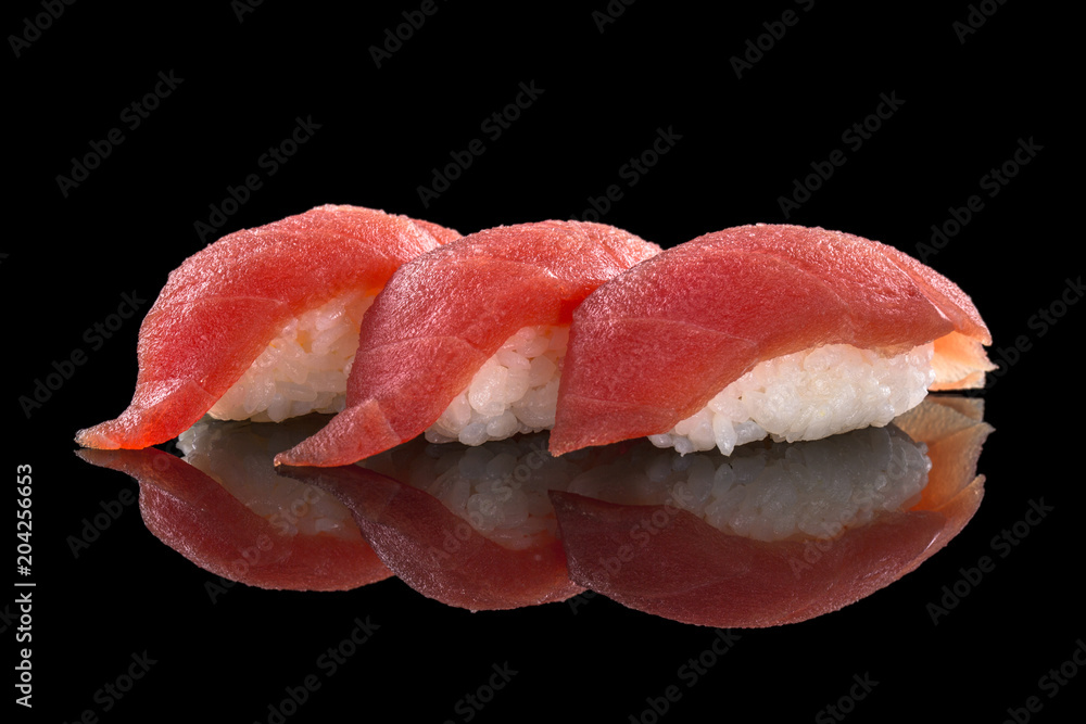 nigiri with tuna - sushi set on the black background