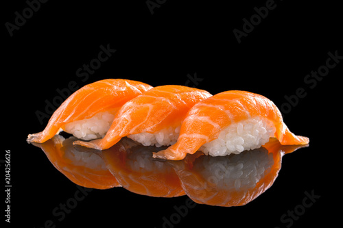 salmon nigiri sushi on the black background