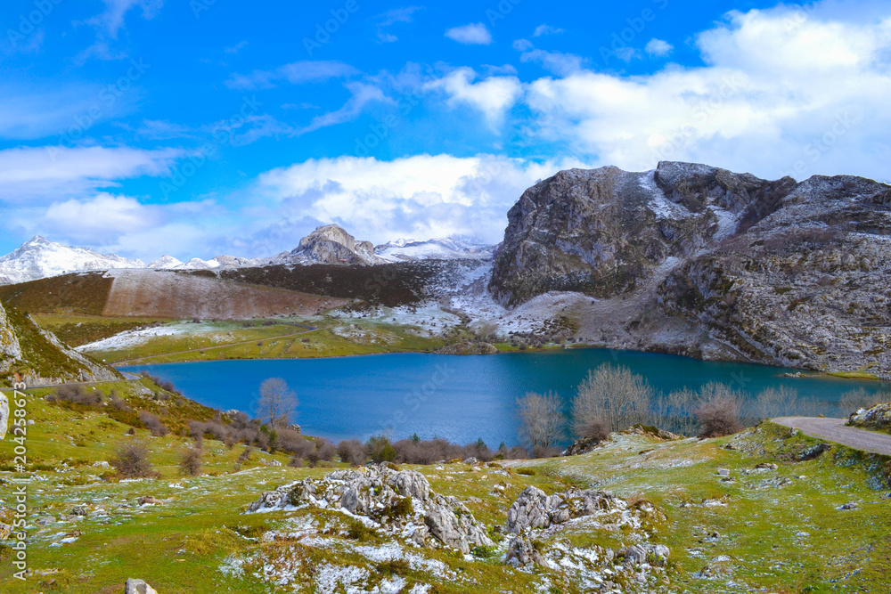 Enol Lake in Picos de Europa, Asturias, Spain. Beautiful view of a blue and clear lake in middle of mountains