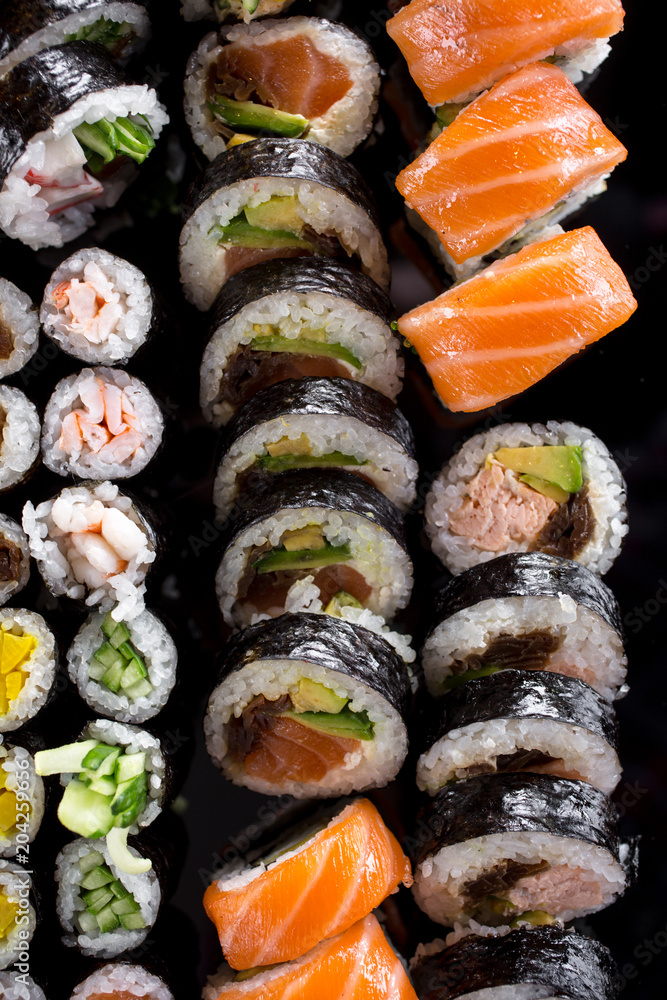 large sushi set on the black background large sushi set on the black background