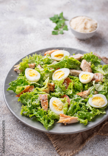 Caesar salad with eggs, chicken and parmesan