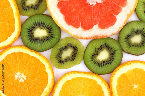 sliced KIWI fruit with a slice of grapefruit and oranges healthy eating