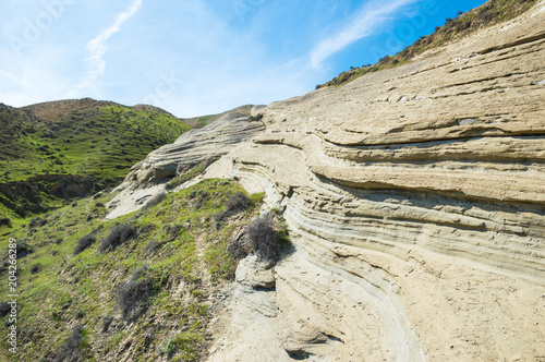 Rocky formation of sand and clay due to weathering photo