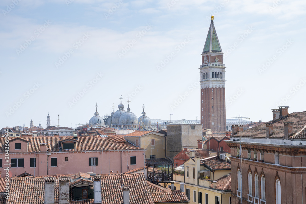 Venice, Italy: Panoramic view on the roofs of the city with the bell tower of San Marco in the background, Italian landscape.