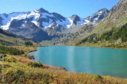 Fototapeta Naklejka Na Ścianę i Meble -  Russia, Altai, Ust-Koksinsky district, the lake Poperechnoye (Cross) in sunny weather