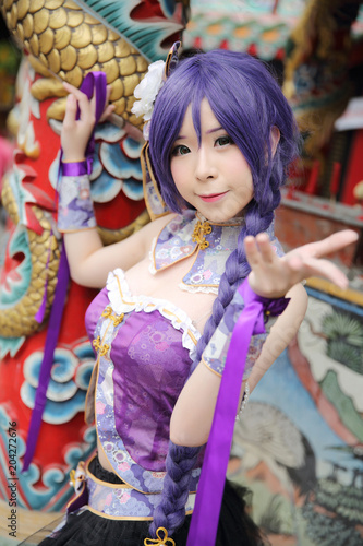 Portrait of asian young woman with purple Chinese dress cosplay with temple © Oran Tantapakul