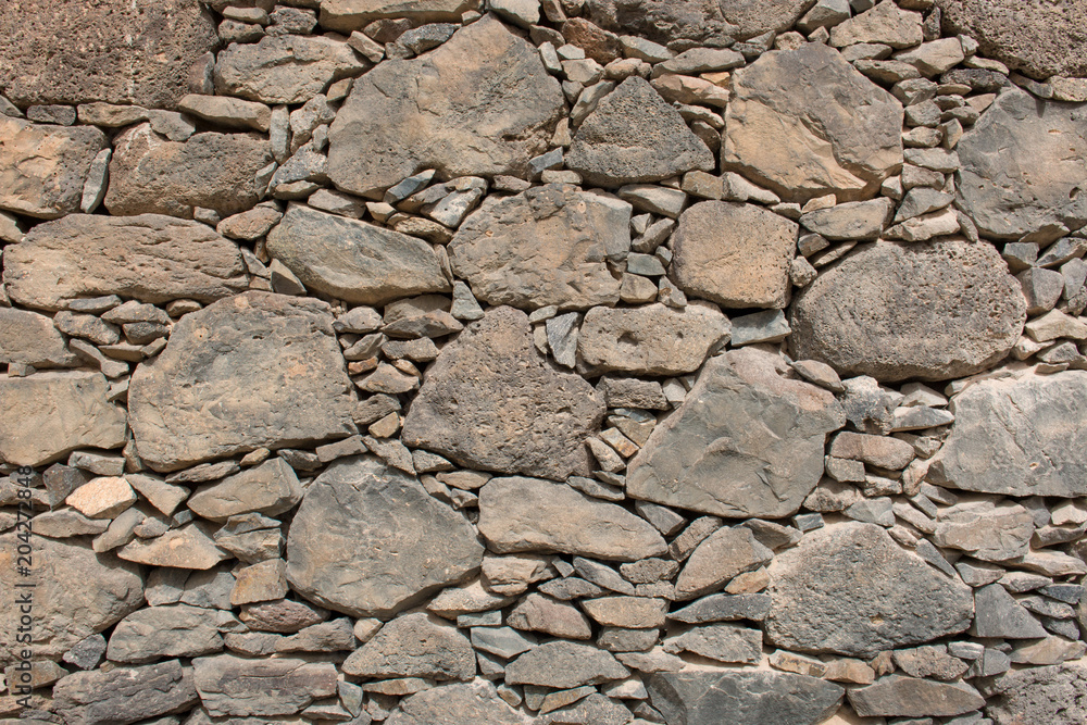 Hintergrund – Natursteinmauer mit eckigen Vulkangestein Hintergrund – Natursteinmauer mit eckigen Vulkangestein