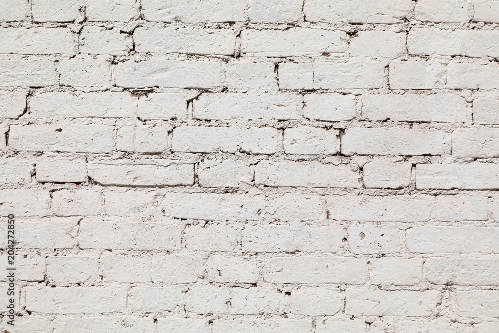 old wall from a white brick with a regular laying. horizontal direction old wall from a white brick with a regular laying. horizontal direction