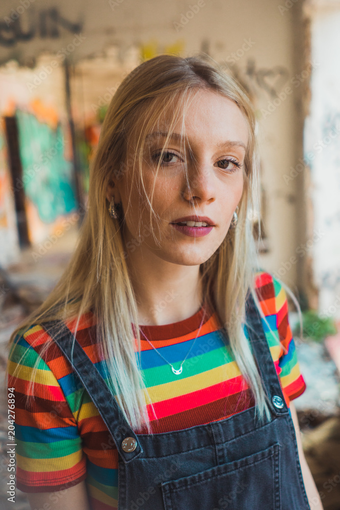 Rebel girl among bright graffiti