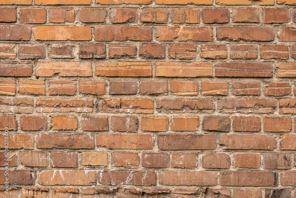 Fototapeta premium Old house wall of red destroyed bricks