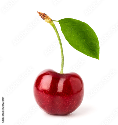 Foto Ripe red cherry with leaf close-up on a white background.