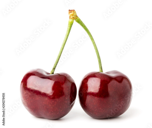 Two ripe red cherries on a white isolated.
