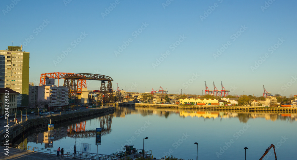 Panorama of the industrial part of La Boca, with cranes of the port and the bridge of Avellaneda in the background. Buenos Aires, Argentina