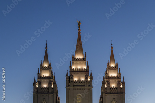 The Angel Moroni and spires of Salt Lake Temple at sunset in springtime. The Church of Jesus Christ of Latter-day Saints, Temple Square, Salt Lake City, Utah, USA.