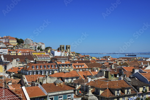 Beautiful view of the city of Lisbon, with the skyline and the Lisbon Cathedral and the Tagus River on the background; Concept for travel in Lisbon