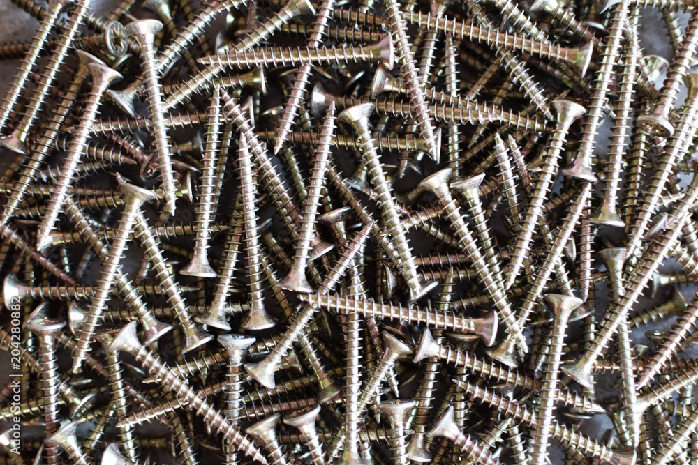 Closeup of metal screws as construction and repair background. Closeup of metal screws as construction and repair background.