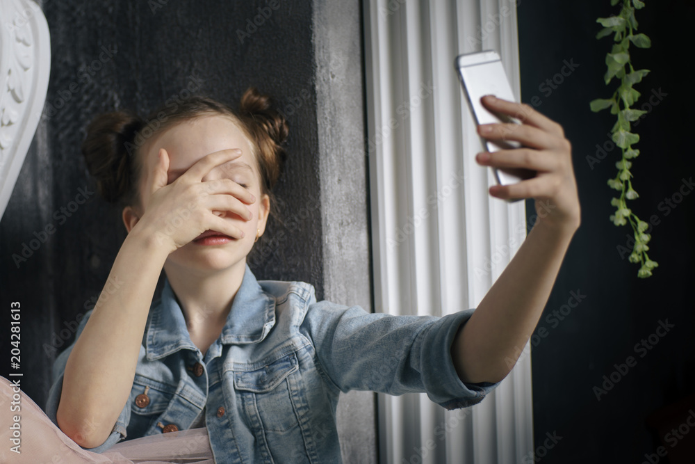 young sad vulnerable girl using mobile phone scared and desperate suffering online abuse cyberbullying being stalked and harassed in teenager cyber bullying concept young sad vulnerable girl using mobile phone scared and desperate suffering online abuse cyberbullying being stalked and harassed in teenager cyber bullying concept