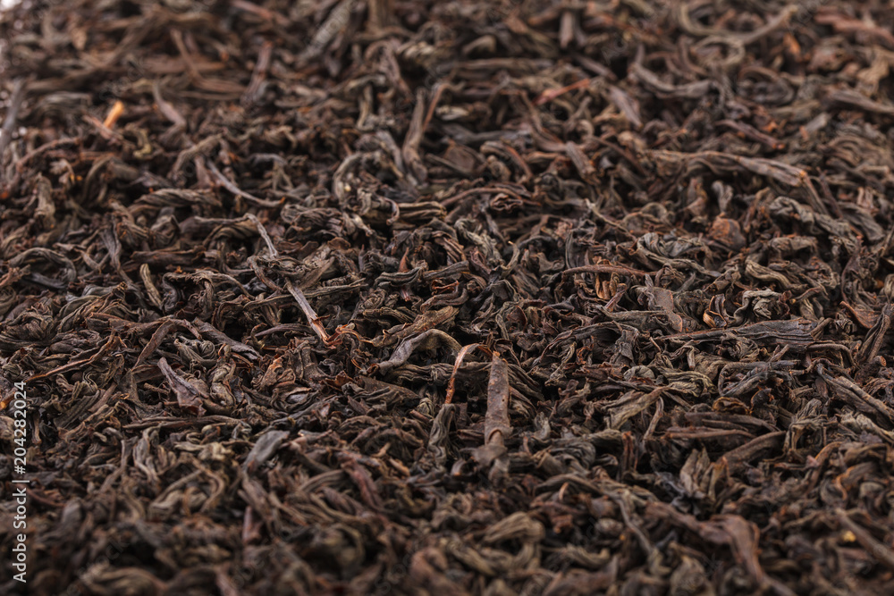 Dried tea leaves. Large leaf black tea. Dried tea leaves. Large leaf black tea.