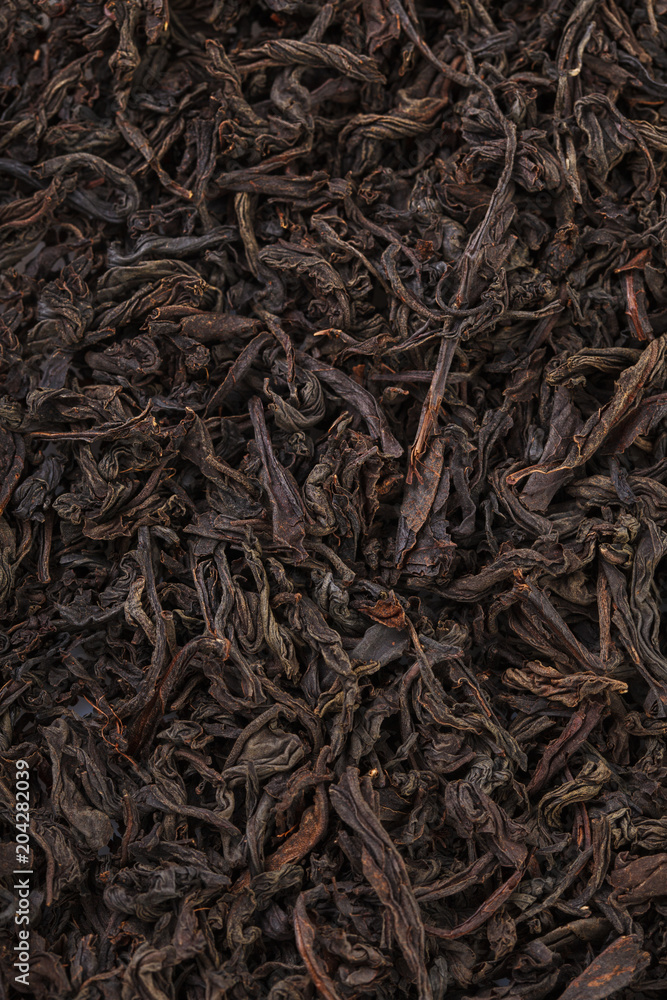 Dried tea leaves. Large leaf black tea. Dried tea leaves. Large leaf black tea.