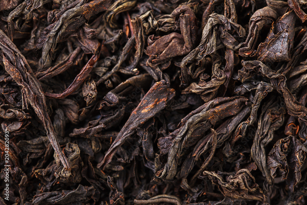 Dried tea leaves. Large leaf black tea. Dried tea leaves. Large leaf black tea.