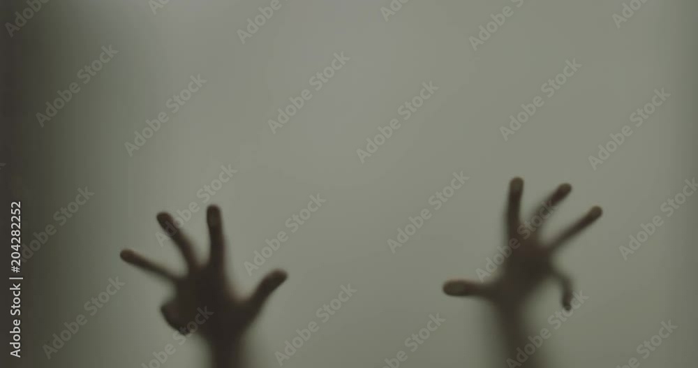 Shadowy figure behind glass / fear, panic concept Shadowy figure behind glass / fear, panic concept