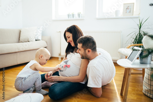 Pregnant women with her husband. Happy family in anticipation of the birth of a new baby.