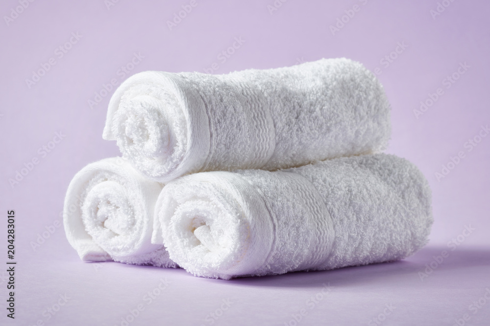 White spa towels on purple background White spa towels on purple background