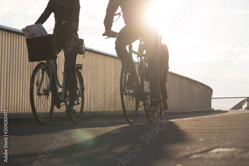 COPENHAGEN, DENMARK - SEPTEMBER 22 2017: Cyclists on bridge inderhavnsbroen on a sunny morning © dreamansions