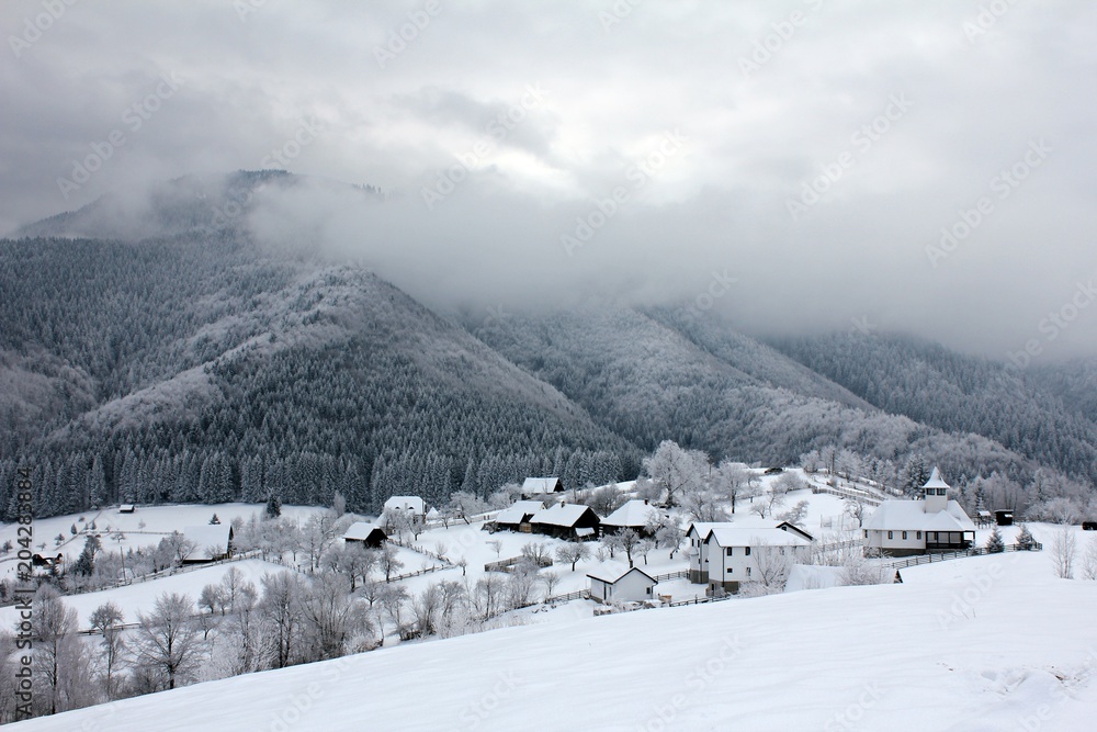 Winter landscape in a mountain village Winter landscape in a mountain village