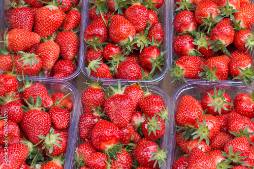 Strawberries in containers for sale on the market
