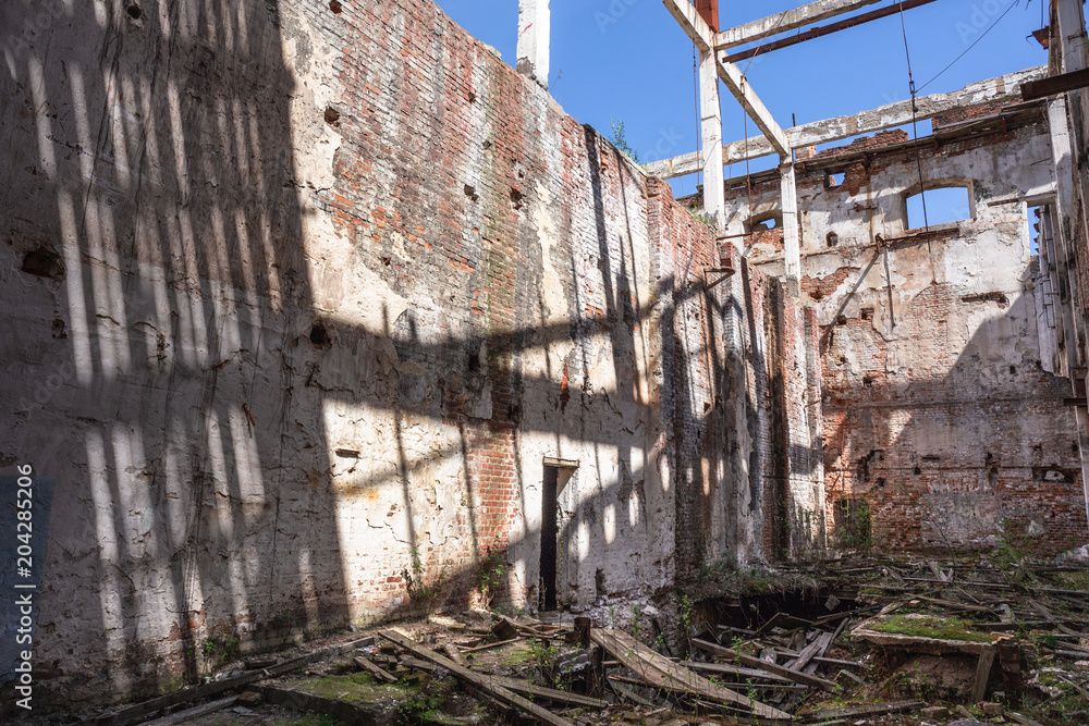 Ruins of abandoned old broken industrial factory or warehouse buildings after disaster, war or cataclysm Ruins of abandoned old broken industrial factory or warehouse buildings after disaster, war or cataclysm