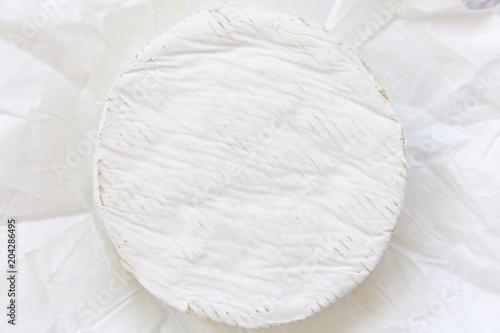 Camembert cheese. Flatlay, closeup. Top view.