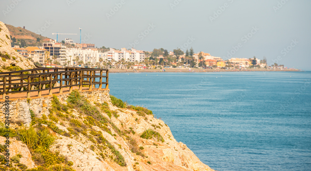 wooden promenade along the sea coast situated on a cliff rock in Rincon de la Victoria, Costa del Sol, Andalucja